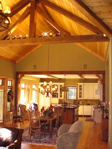 One of Rand Soellner's mountain home projects, this is a view from the Hearth Room through the Dining and into the open plan kitchen.  Interior designs for the mountains or anywhere else can benefit from this company's special touch.