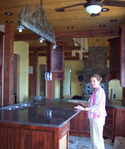 Here you can see Merry Soellner supervising the installation of the granite slabs she selected for this luxury home design project, under construction.