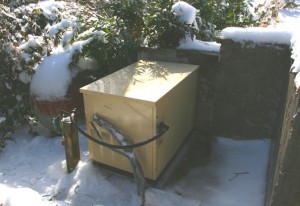 Mountain home designers specifying backup systems.  The generator is on the right and the LP tank is on the left.