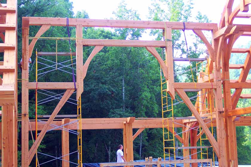 Timber frame home hammer trusses spanning long distances.  Castle home designed by Rand Soellner Architects, (C)Copyright 2005-2010, All Rights Reserved Worldwide.  Timber frame photo, fabrication & erection by Jeff Johnson Timber Frame inc.