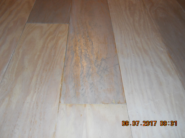 distressed plywood plank floor whitewashed